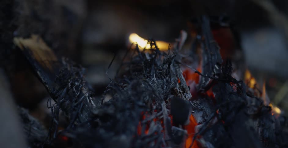 A fire burns outside