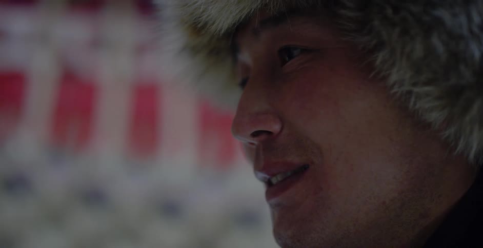 A man wears a fur hat