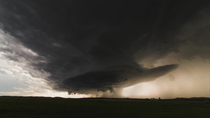 Time lapse of a tornado forming in the distance