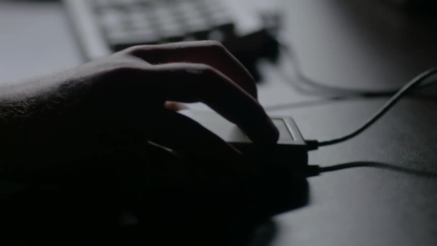 A man uses a computer mouse