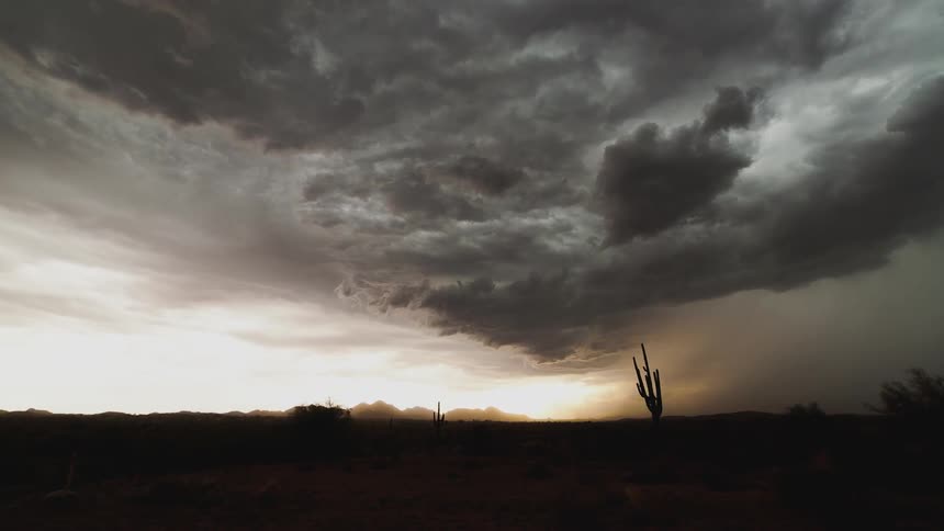 Storm clouds moving in over a rural area