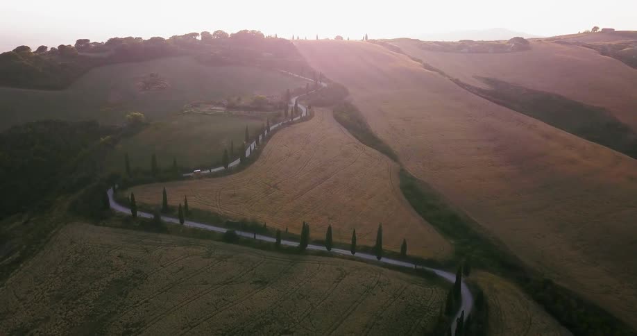 Road winds through fields and the country
