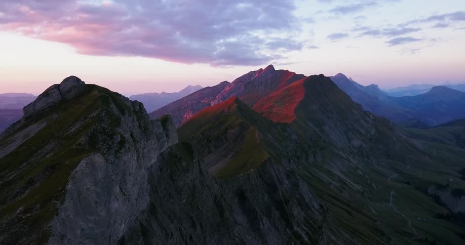 Red tinted mountains at sunrise