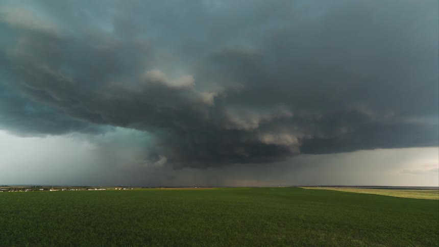 Storm clouds collect over a field
