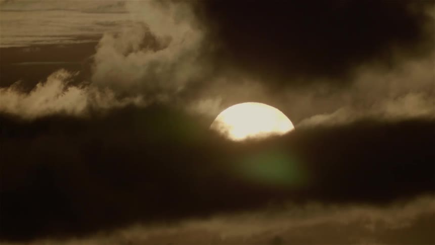Dark clouds move across the moon