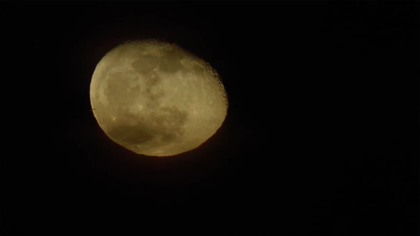 The moon is rotating as is rises in the night sky