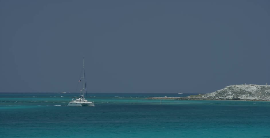 A boat turns toward shore