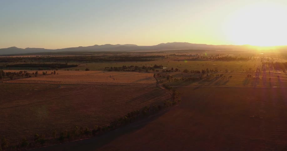 Sun rises over flat plains