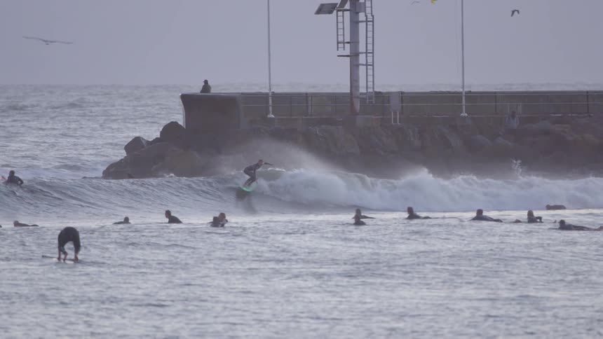 Surfers are preparing for waves