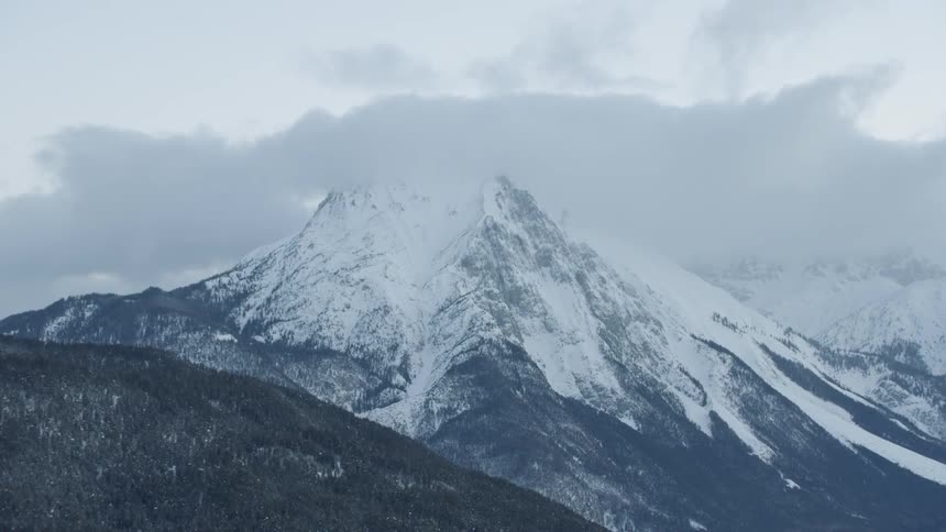 Snowy mountains on a cloudy day