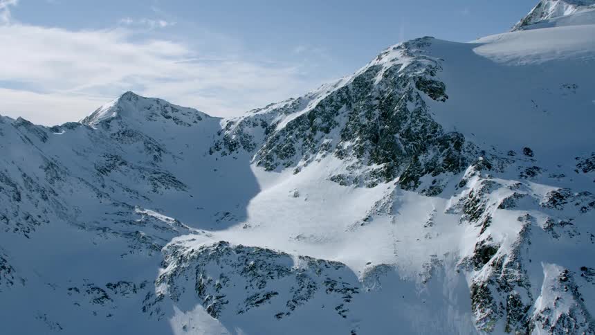 Snow covers a mountain ridge