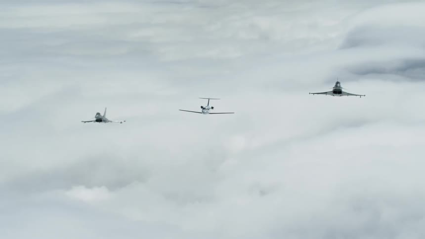 Jets fly above clouds in the sky