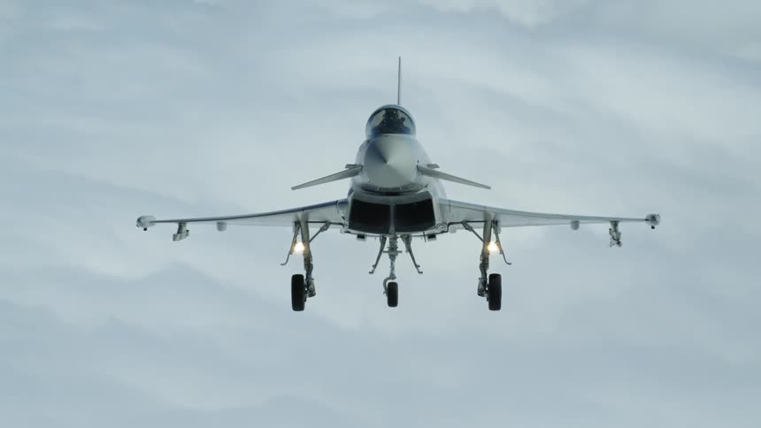 The jet flies high in the thick clouds