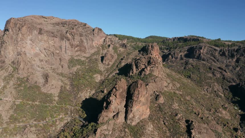 Rocky cliffs cover a mountainside