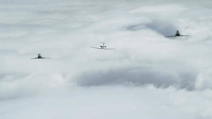 Jets fly above clouds in the sky
