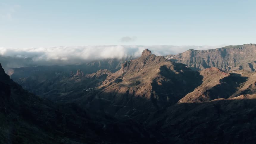 Clouds float above a canyon