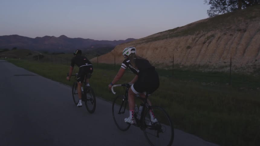 People riding bikes down a trail