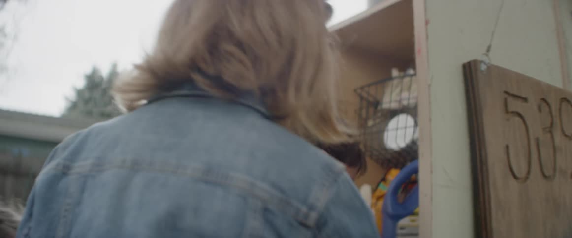 The children open the cupboard outside