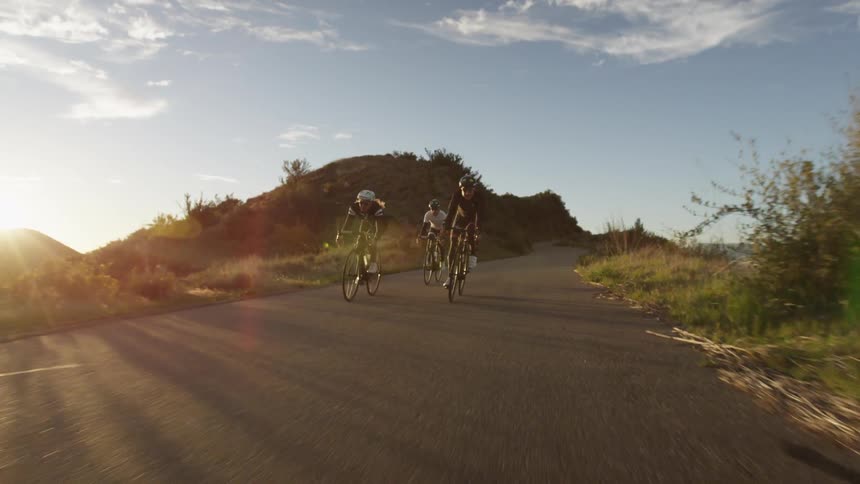 Bikers are biking down the hill