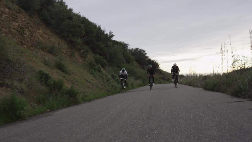 Bikers are biking down the hill