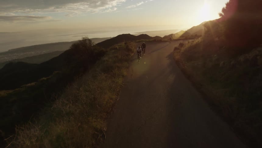 Bikers are biking down the hill