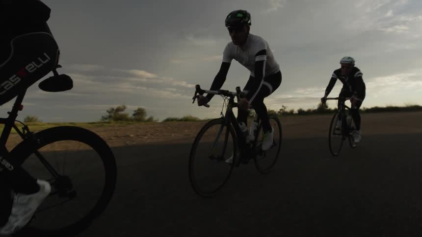 Bikers are biking down the road