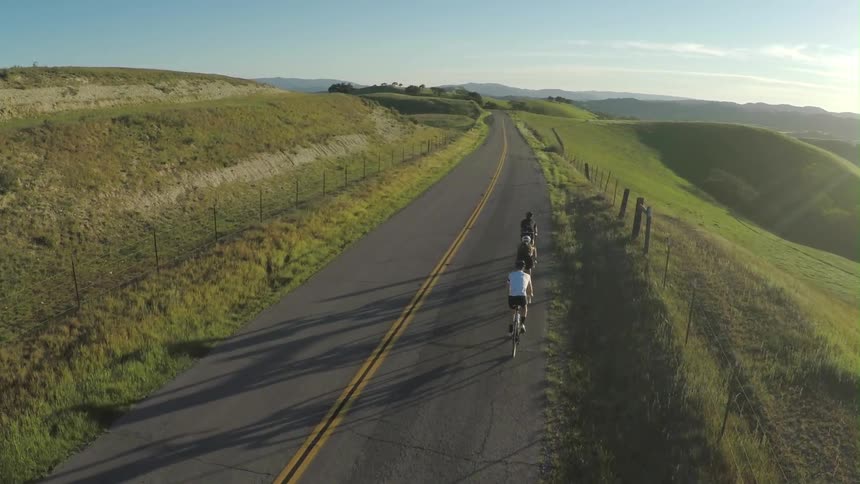 Bikers are biking down the hill