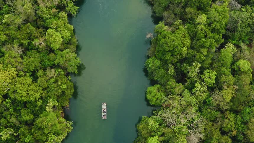 A boat floats down a river