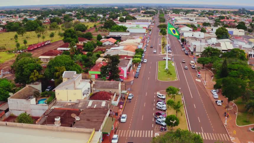 The town is busy below with vehicles traveling