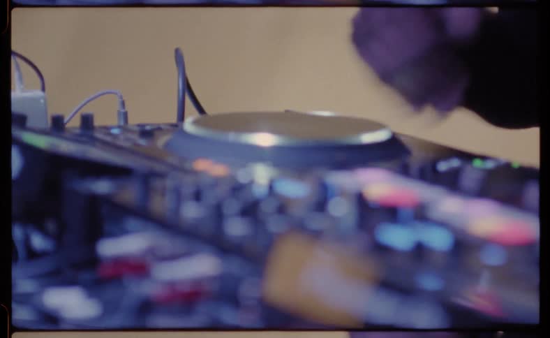 A dj moves the turntable by hand