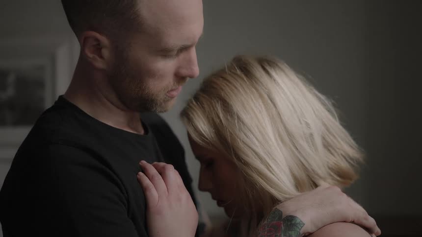 A man consoles a woman