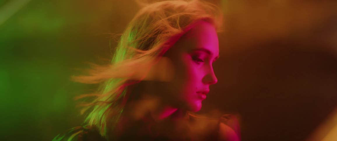 Blond woman's hair blows in the breeze