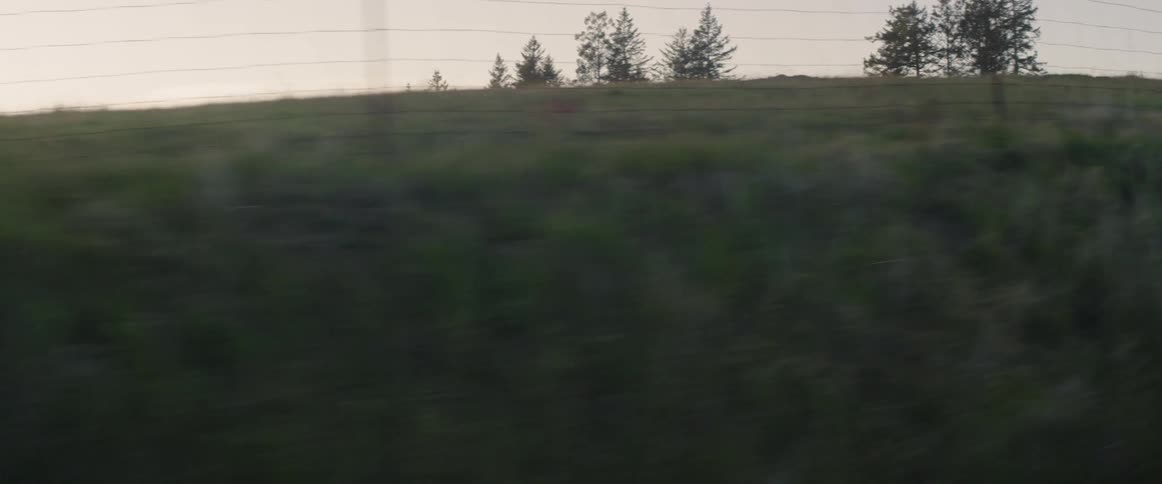 An suv drives down a rural road