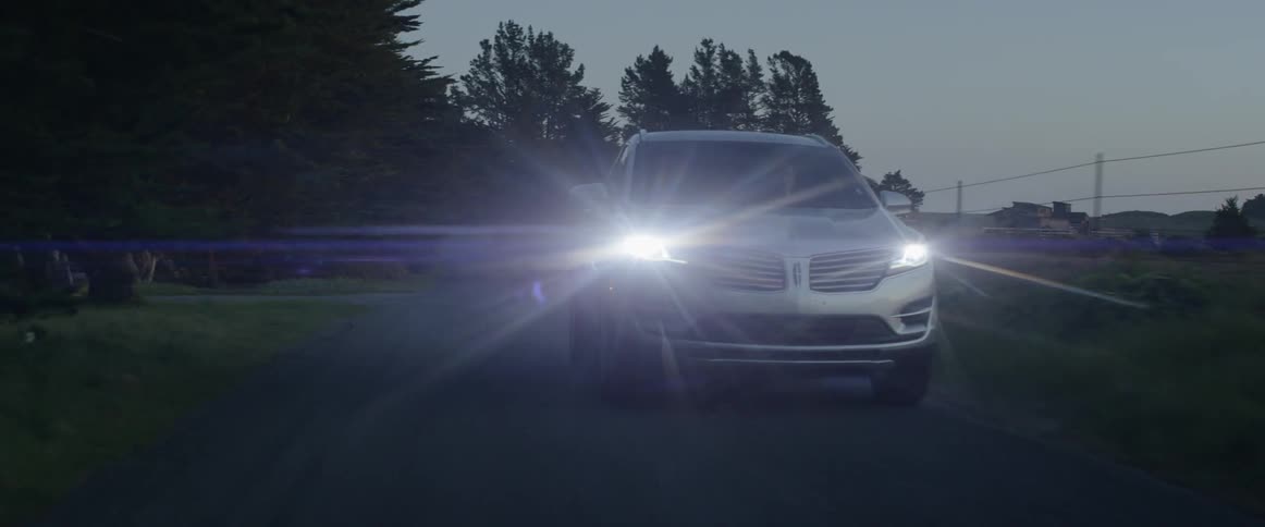 An suv drives down a rural road