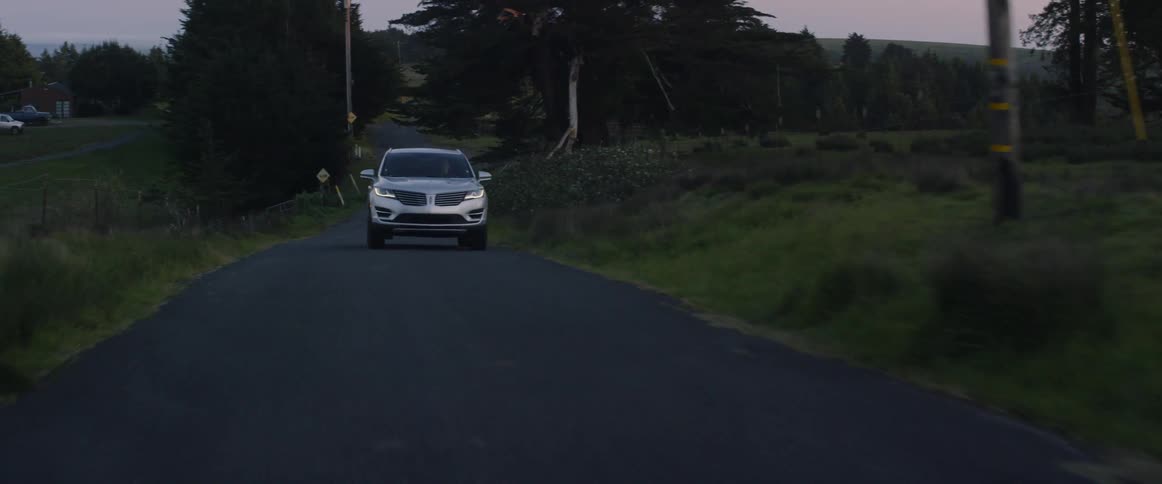 The car is driving up the hill