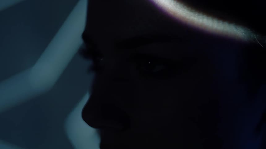 Lights shine on a woman's face