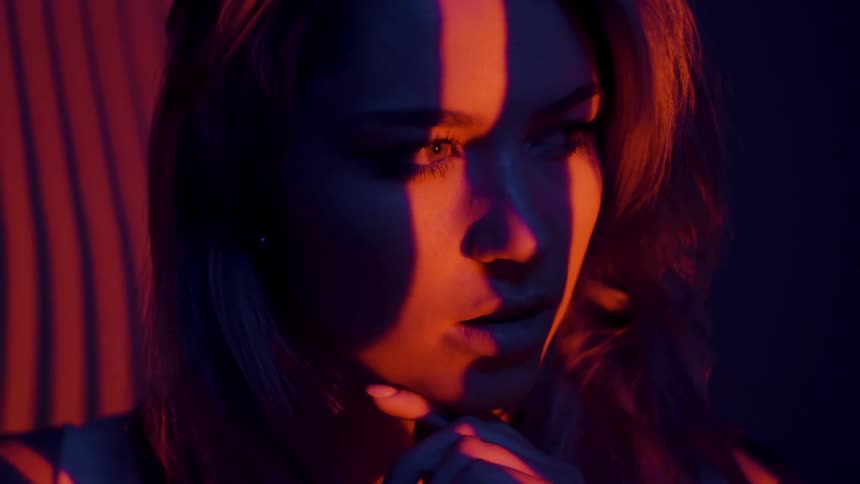 Lights shine on a woman's face