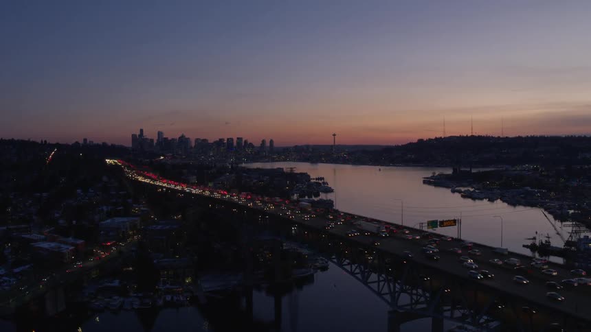 Rising over Lake Union during the Seattle evening rush hour commute