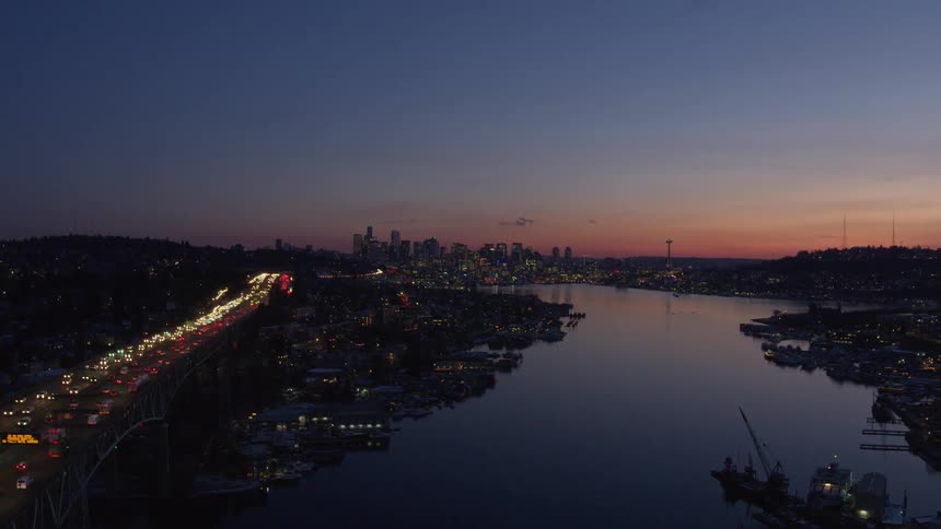 Flying over Lake Union at sunset with downtown Seattle in the distance