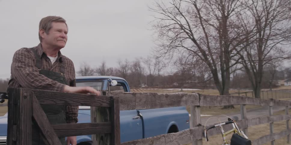A man is getting to the farm