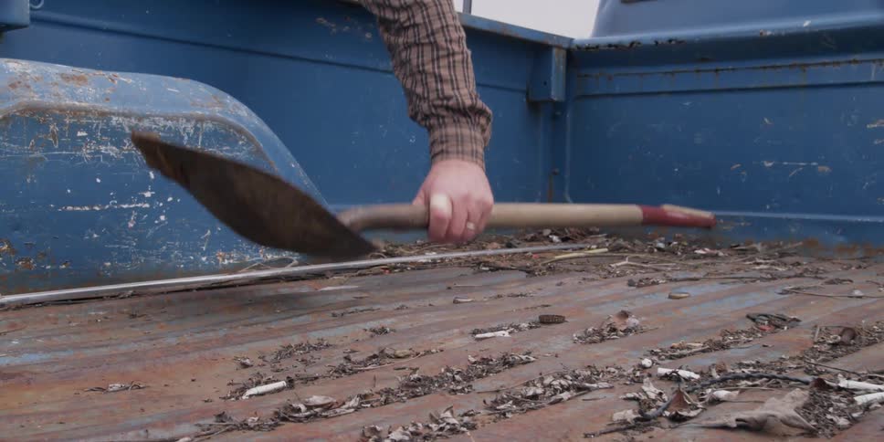 A shovel  is picked up from a truck