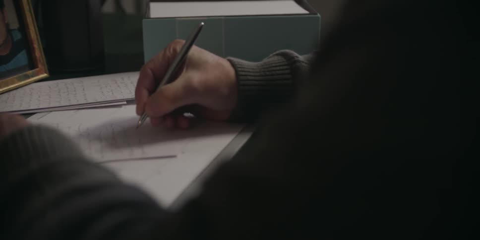 Someone is writing a letter