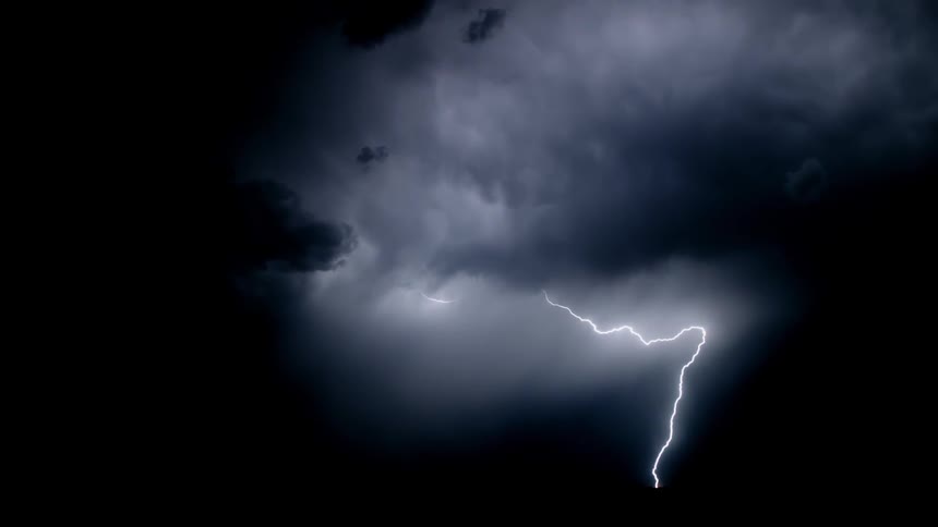 Lightning flashes in the night sky