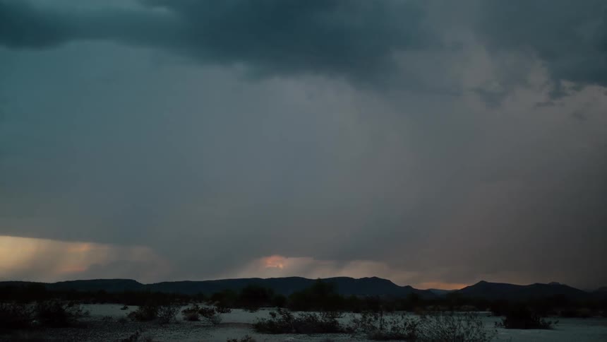 Lightning flashes over mountains