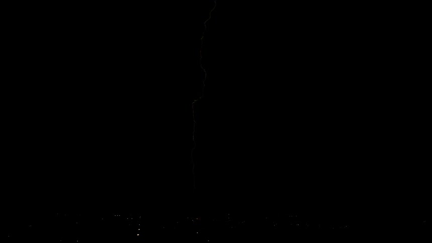 Lightning streaks across night sky