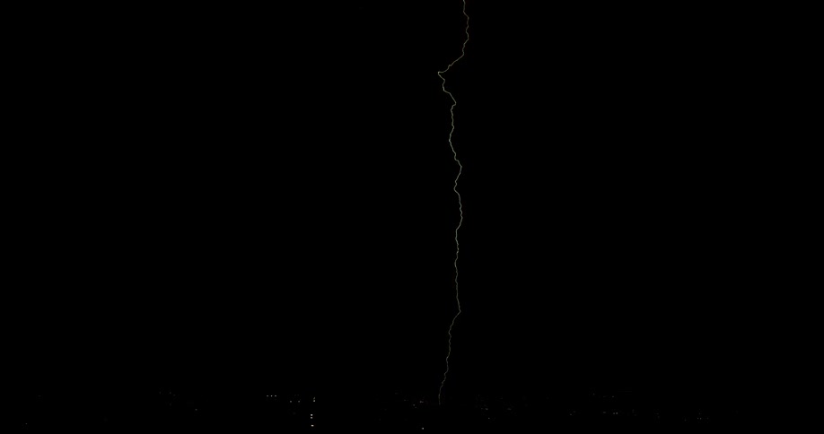 Bright lightning flashes in the black sky