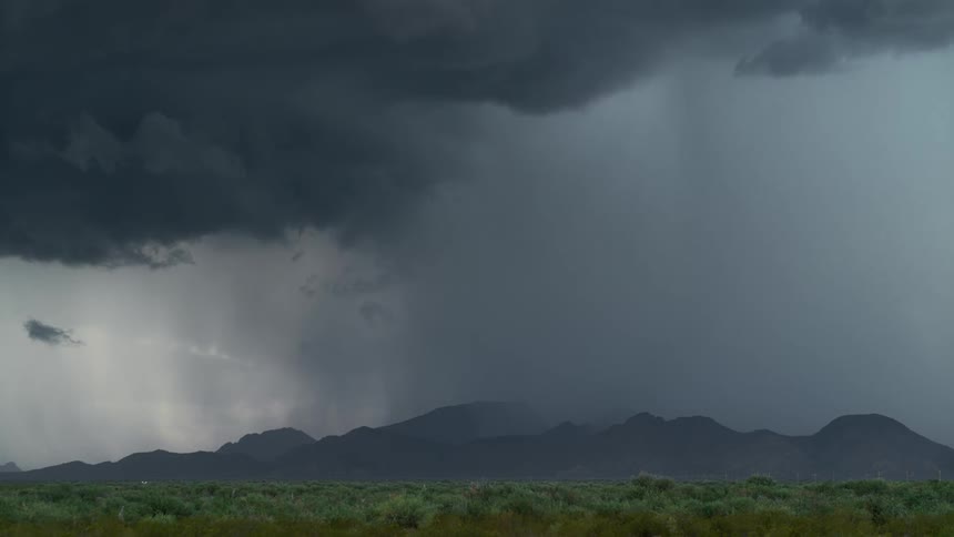 Lightning flashes over mountains