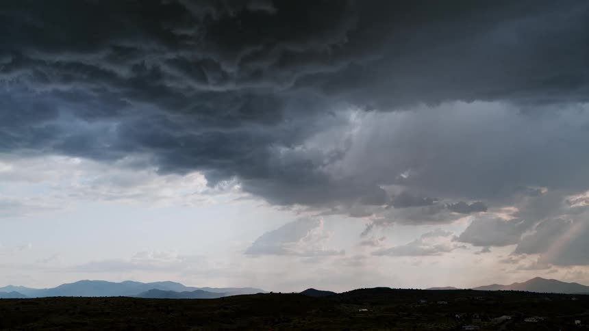 Lightning flashes over mountains