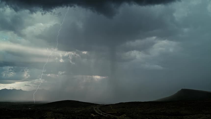 Lightning flashes in the dark sky
