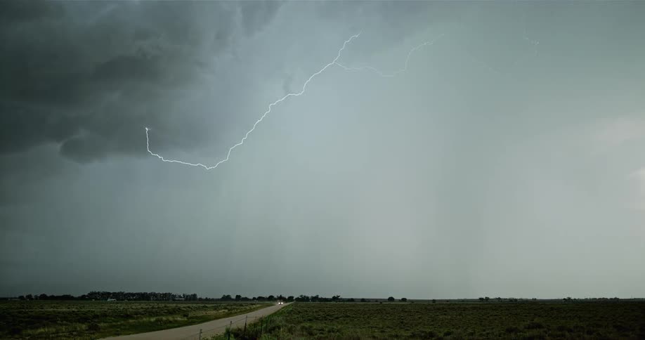 Lightning streaks across a cloudy sky